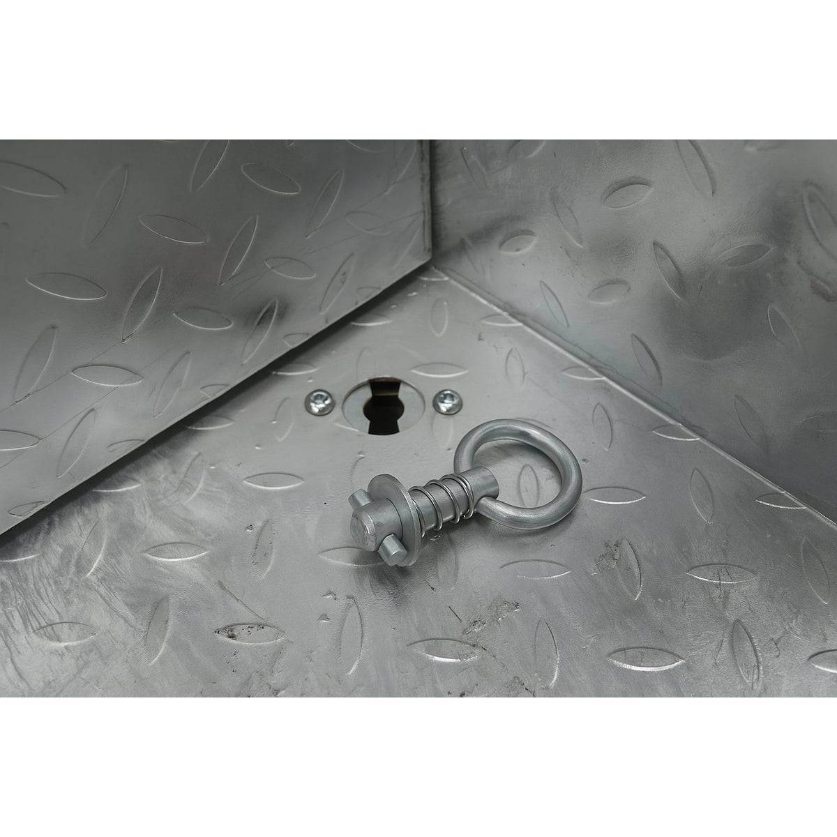 TurnLock receiver installed in a checker plate toolbox floor with tie-down point